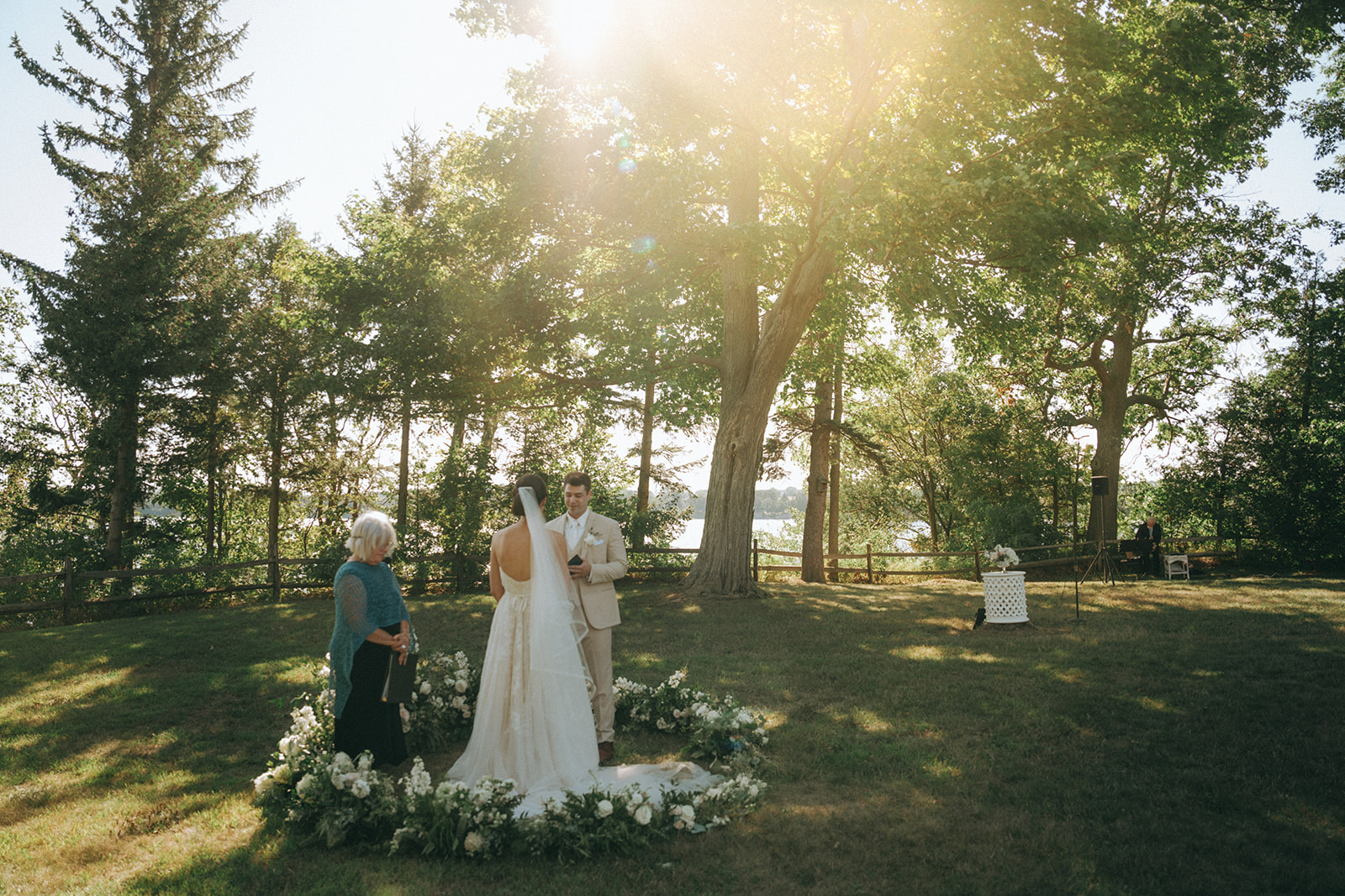 Grand Isle Lake House Lakeside Wedding Florals – Burlington Vermont Wedding Florist Lush lakeside ceremony flowers and meadow arch design for a waterfront wedding at Lake House in Grand Isle, captured by Anaphora as your Burlington Vermont wedding florist.