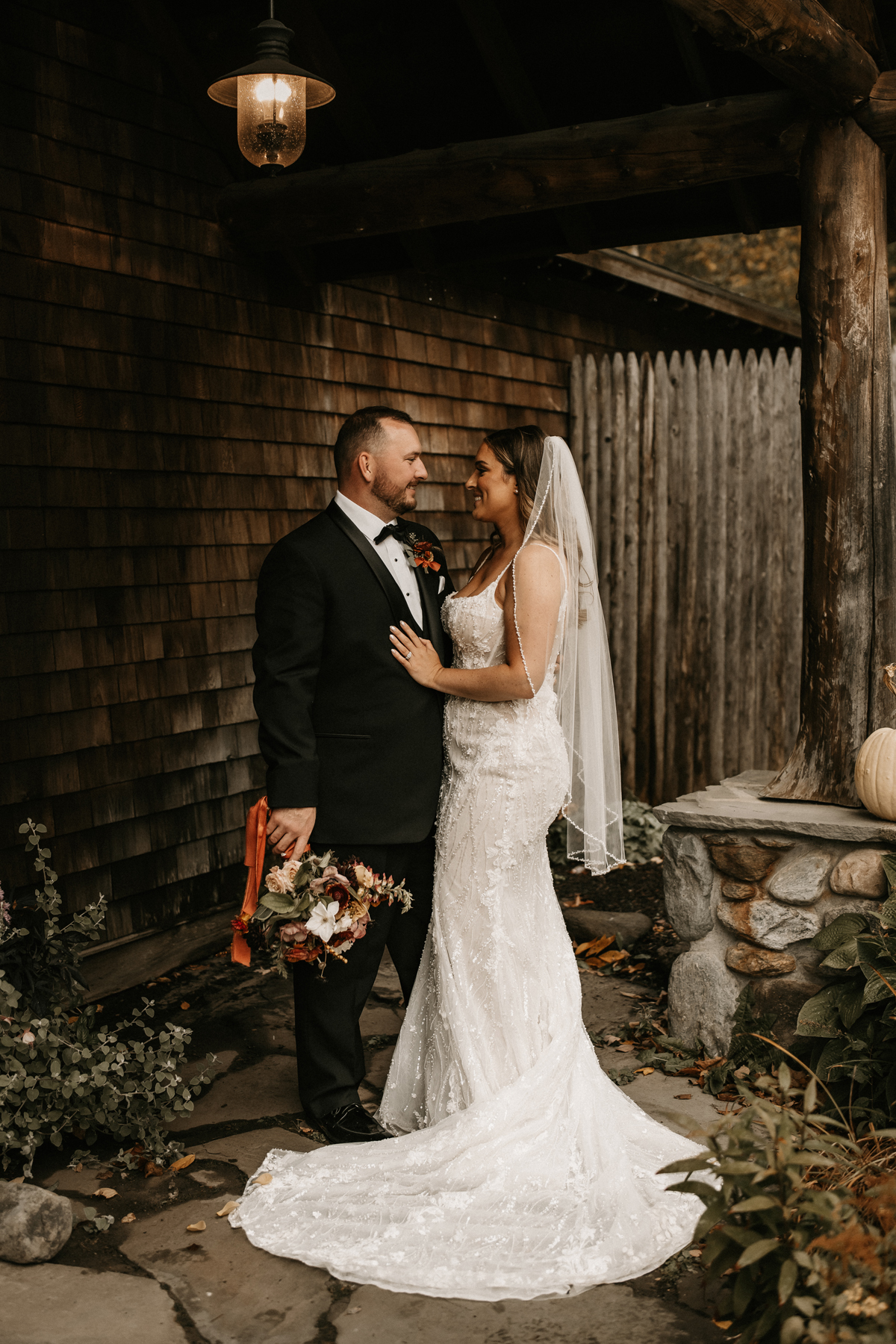 Bride and groom with fall bouquet
