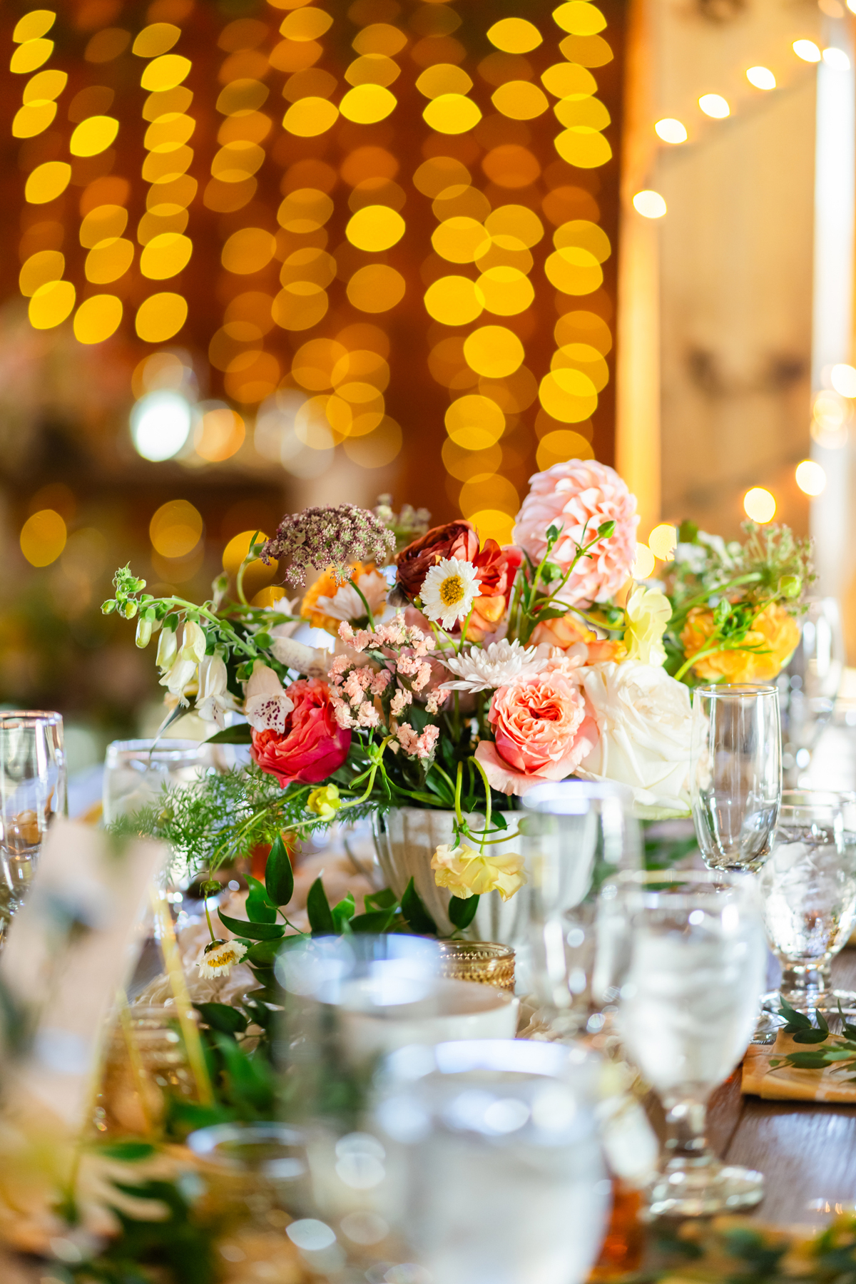 Lake view Fall wedding by a Burlington Vermont wedding florist golden mustard yellow and pink wedding flowers for a lakeside wedding in southern Vermont wedding venue Lake Bomoseen Lodge Castelton Vermont bride and groom first look with golden mustard wedding farmhouse table centerpieces