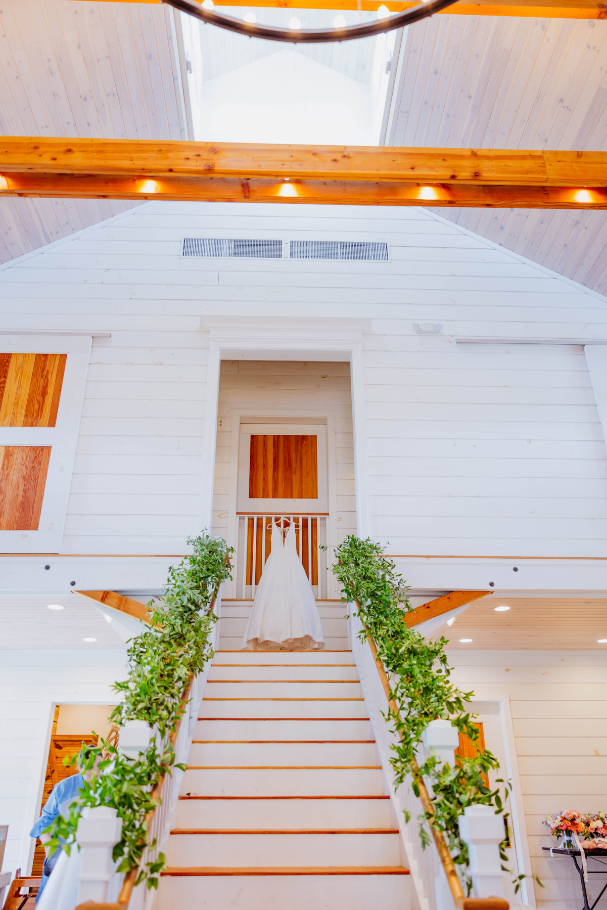 Stowe VT mountain view romantic wedding florals wedding pink and citrus wedding stairwell greenery floral installation wedding reception by a Burlington Vermont Wedding Florist at the Barn at Smugglers Notch wedding venue